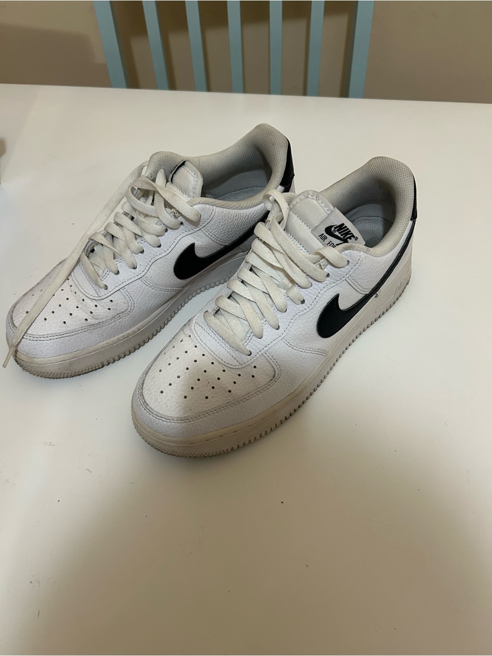 Nike Men’s White Low-Top Sneakers with Black Swoosh Accents